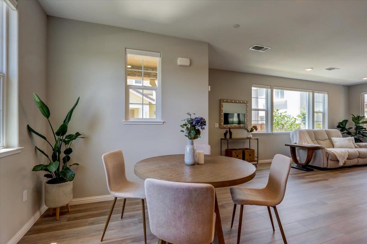 2652 Admiral Circle Hayward, CA 94545 - Photo 12 of 51 a dining room with furniture potted plants and wooden floor