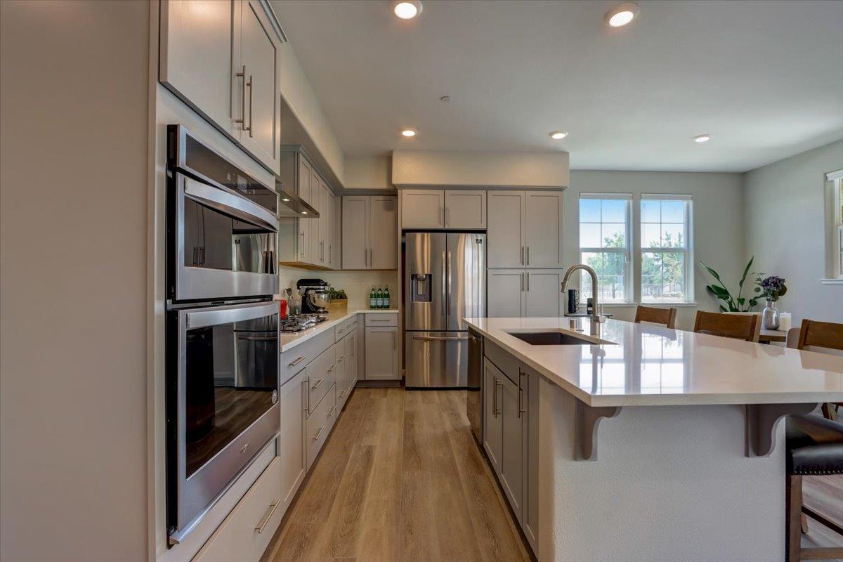 2652 Admiral Circle Hayward, CA 94545 - Photo 14 of 51 a kitchen with stainless steel appliances granite countertop a sink and stove