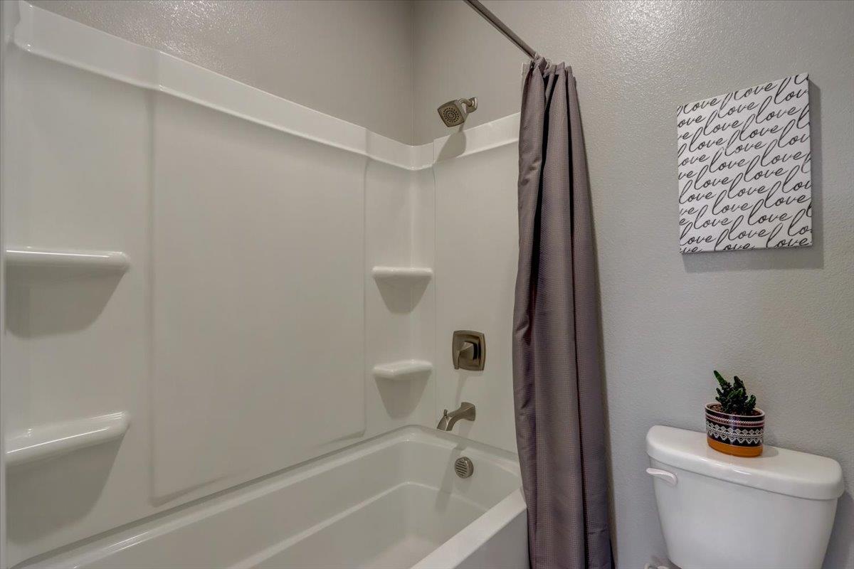 2652 Admiral Circle Hayward, CA 94545 - Photo 25 of 51 a bath room with a toilet a bath tub and a shower