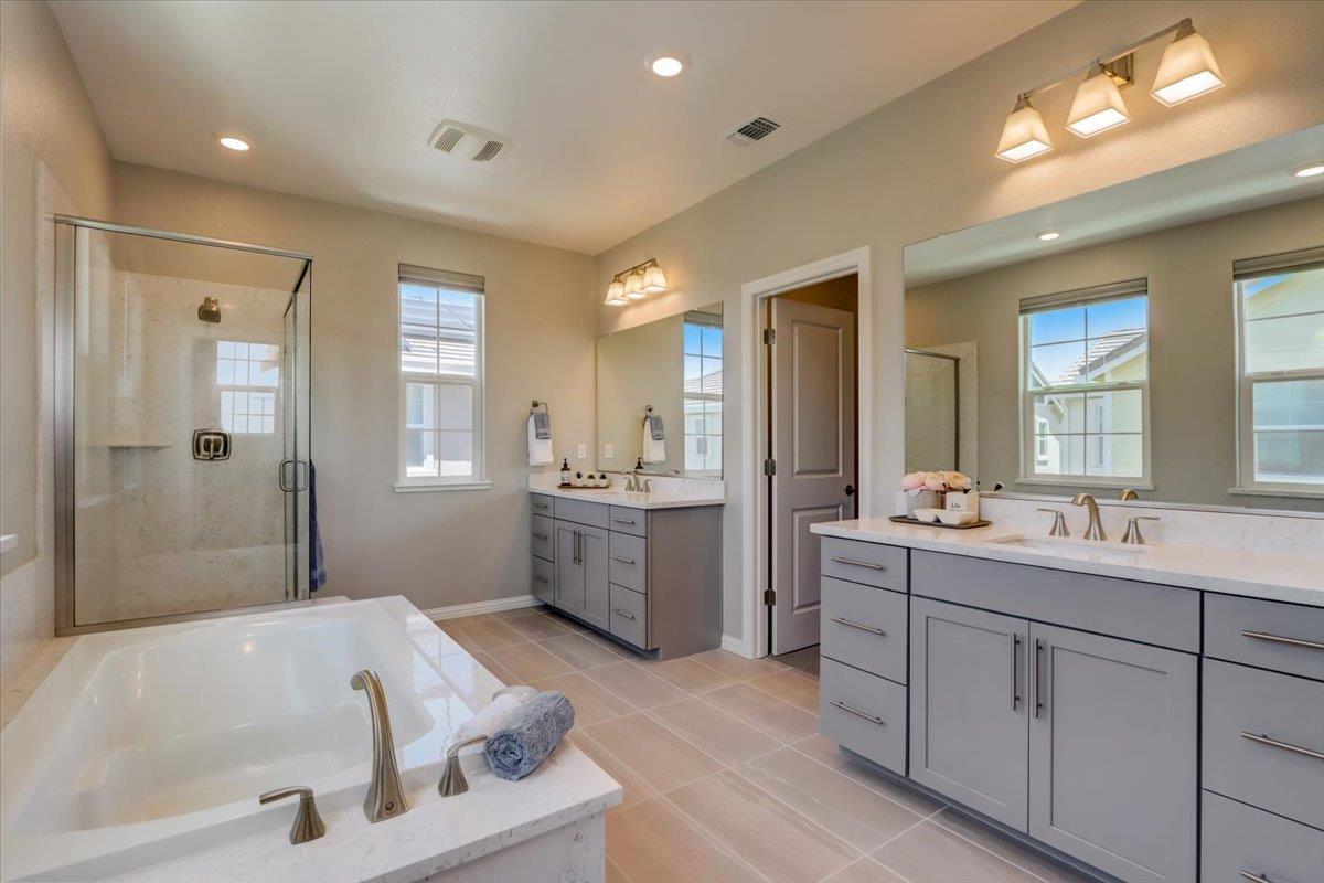 2652 Admiral Circle Hayward, CA 94545 - Photo 35 of 51 a bathroom with a tub a sink shower double vanity