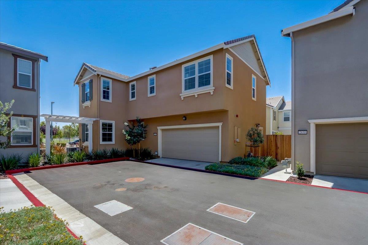 2652 Admiral Circle Hayward, CA 94545 - Photo 44 of 51 a front view of a house with a yard and garage
