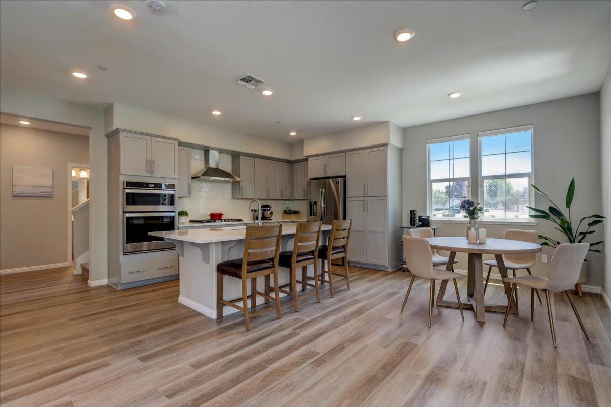 2652 Admiral Circle Hayward, CA 94545 - Photo 9 of 51 a view of a dining room with furniture a rug and wooden floor