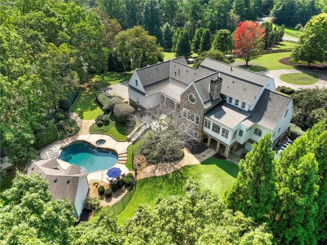 an aerial view of residential house with outdoor space and street view