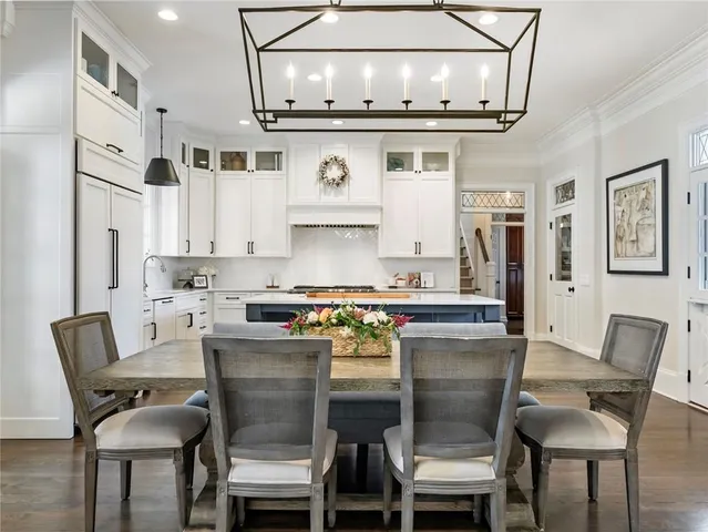 a spacious bedroom with a large bed and a flat screen tv