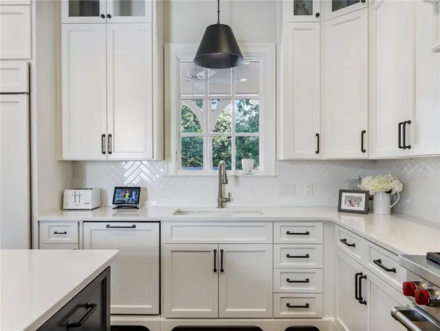 a bathroom with a sink and mirror