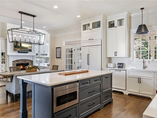 a spacious bathroom with a granite countertop tub and a shower