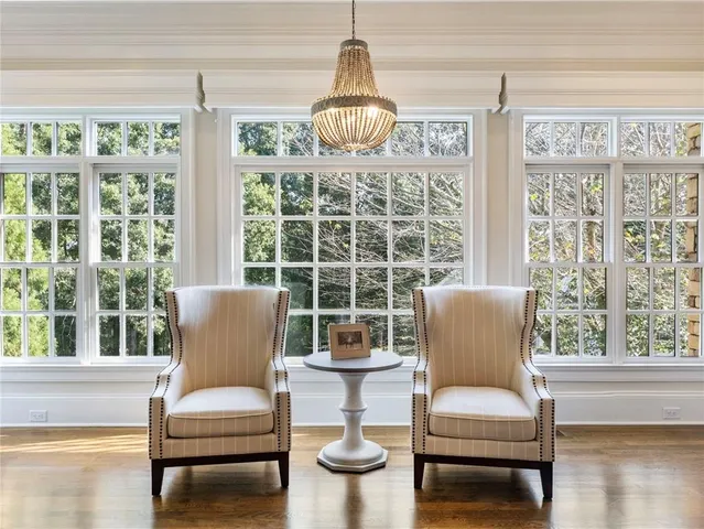 a bedroom with a chandelier and a bed
