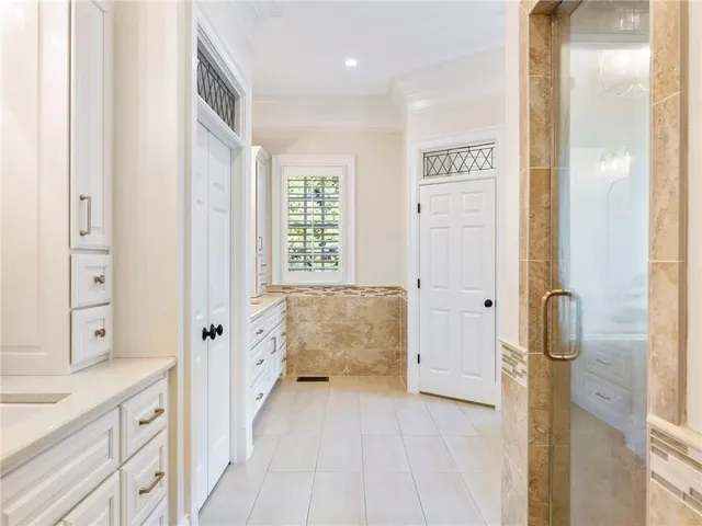 a bedroom with a bed and cabinets