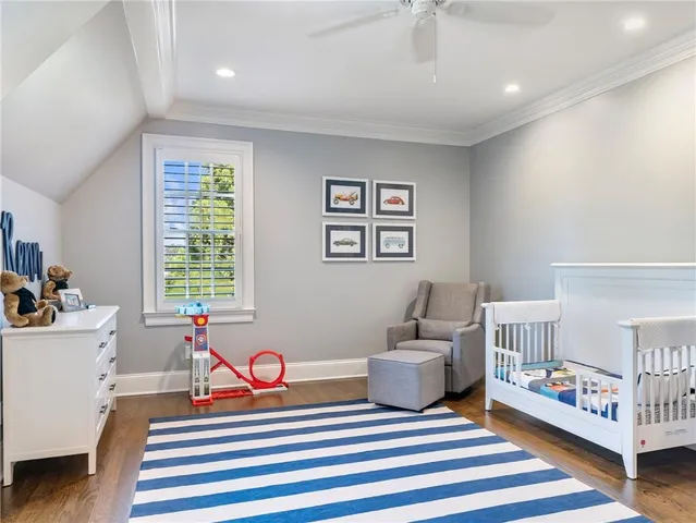 a kitchen with a sink a cabinetry and a potted plant