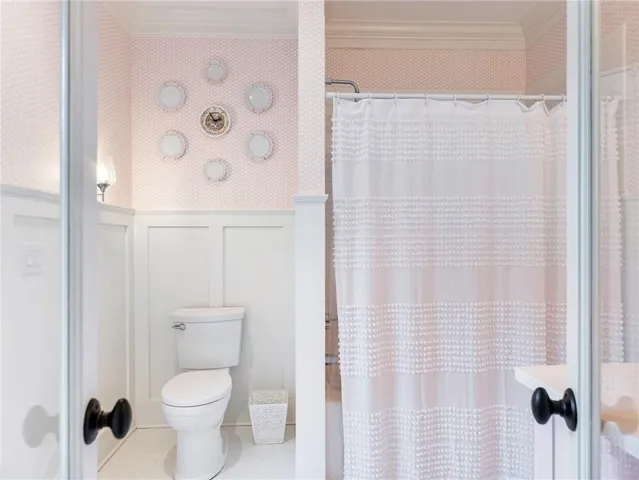 a kitchen with granite countertop white cabinets and stainless steel appliances