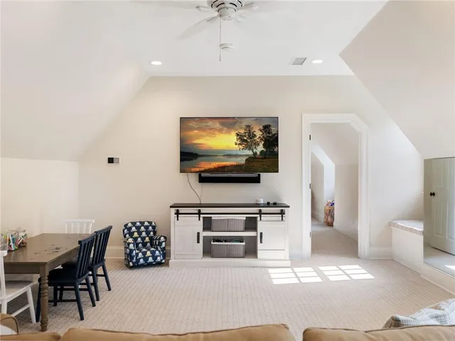 a view of a yard with plants and trees