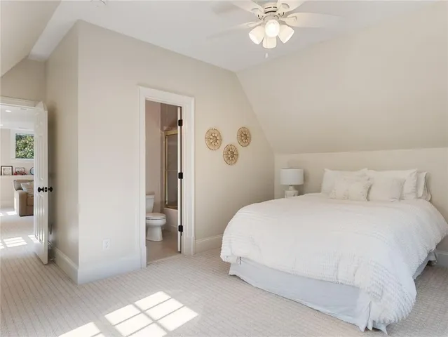 a view of a house with a big yard and potted plants