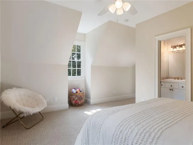 a view of a patio with a table and chairs under an umbrella