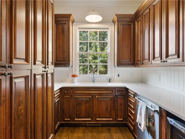 a view of a house with backyard sitting area and garden