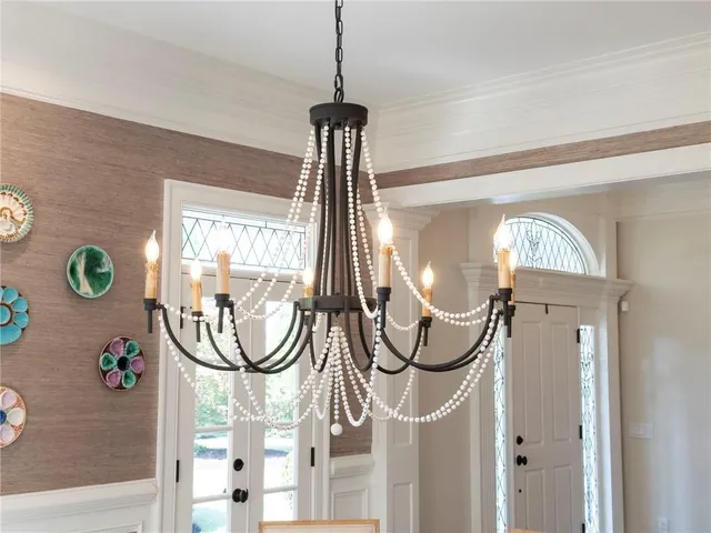 a living room with furniture wooden floor and a dining table