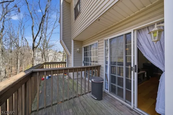 a view of balcony with wooden floor and deck