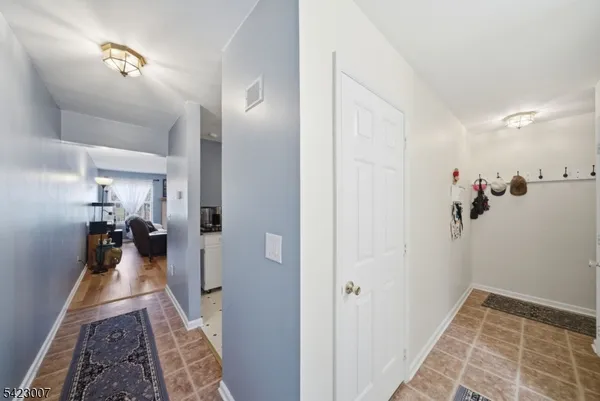 a view of a hallway with a couch