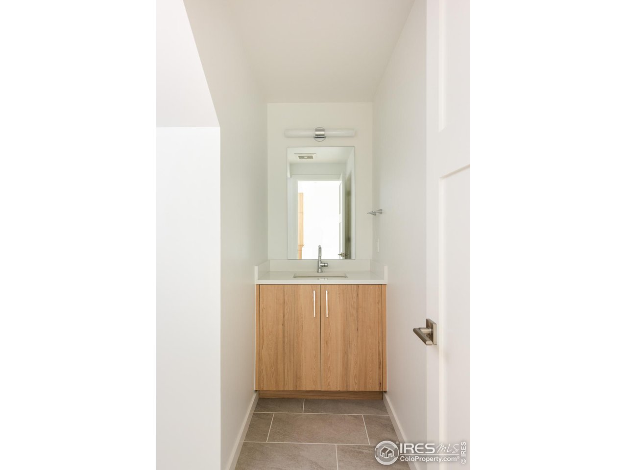 2130 Folsom Street Boulder, CO 80302 - Photo 17 of 40 a bathroom with a sink and a mirror