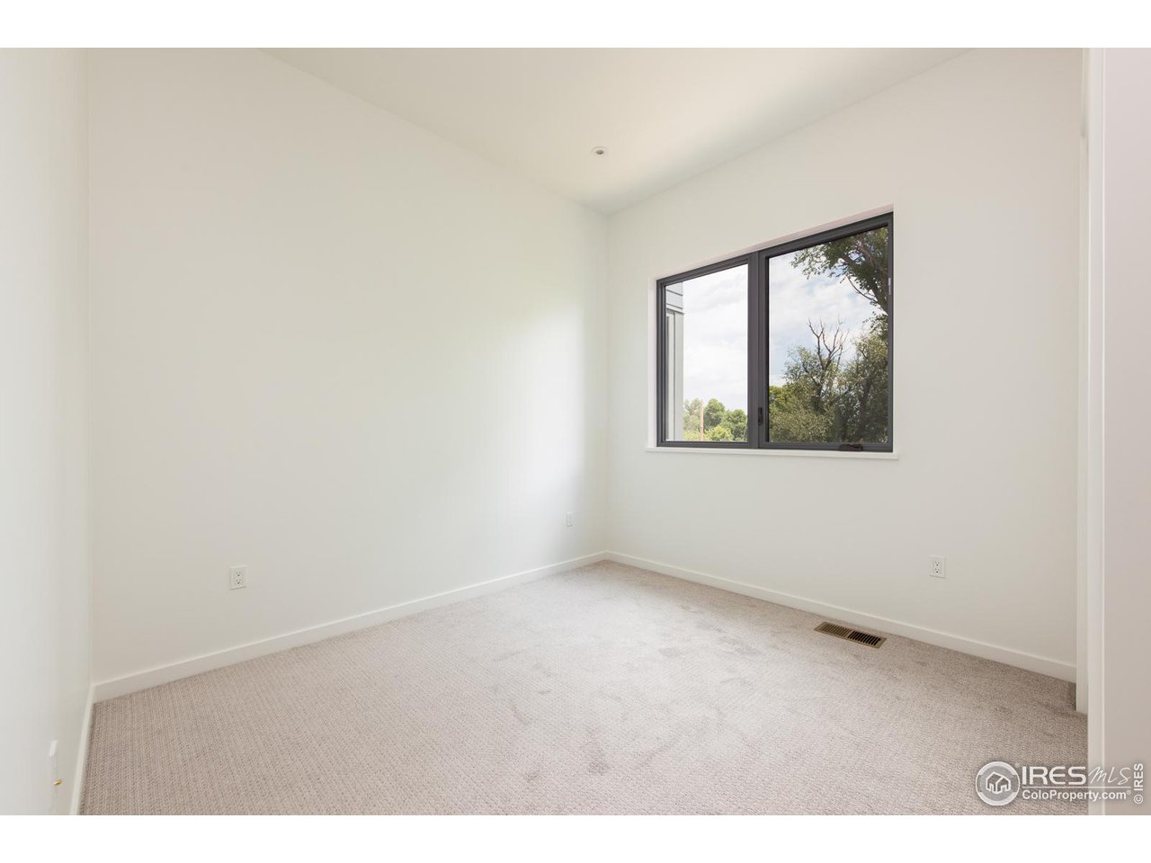 2130 Folsom Street Boulder, CO 80302 - Photo 30 of 40 a view of an empty room with a window