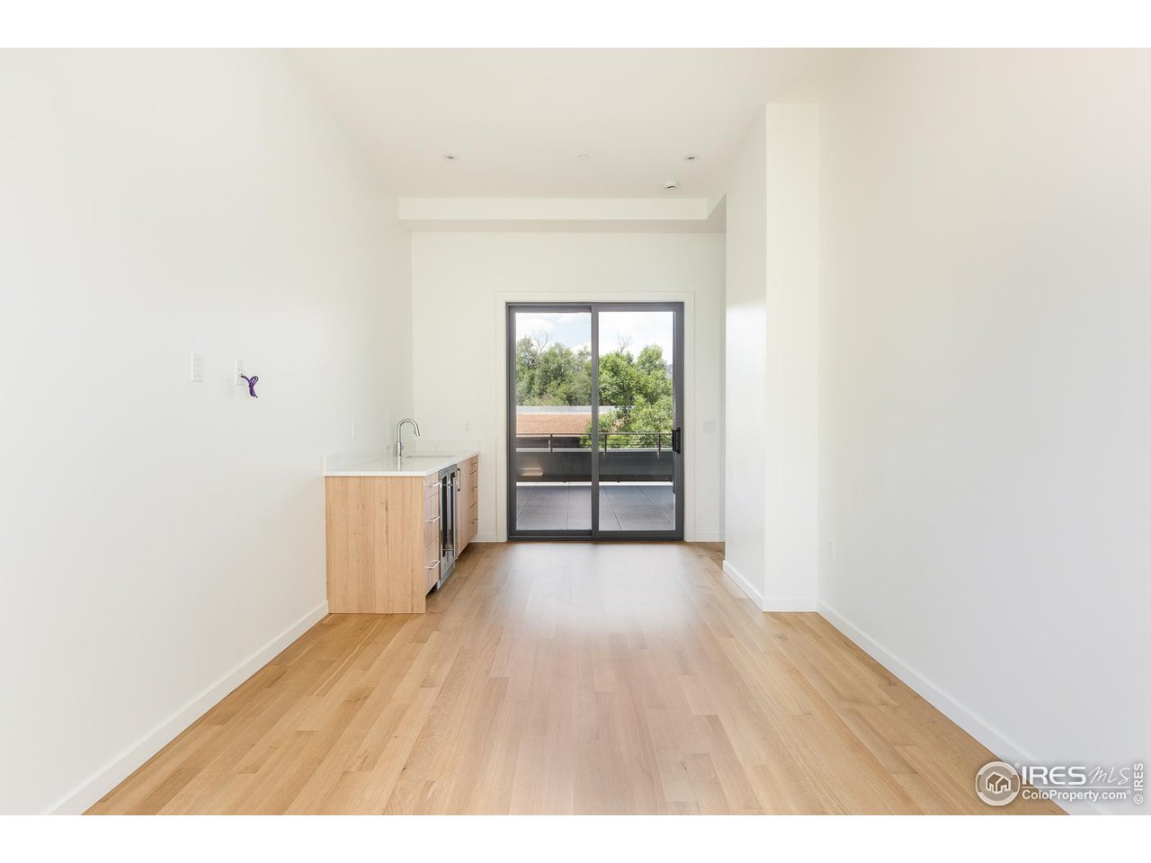 2130 Folsom Street Boulder, CO 80302 - Photo 36 of 40 a view of a room with wooden floor and windows