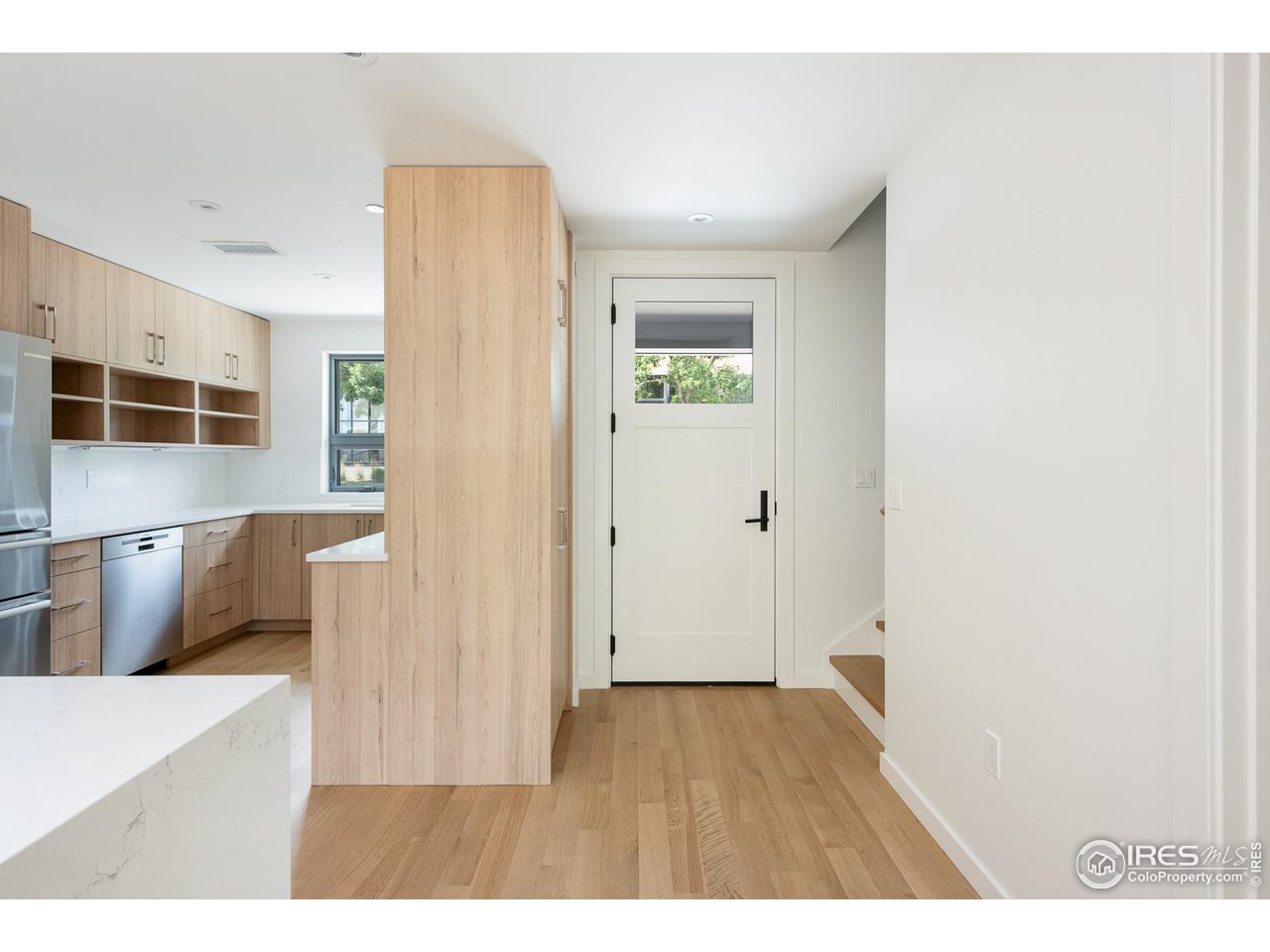 2130 Folsom Street Boulder, CO 80302 - Photo 6 of 40 a room with wooden floor and windows