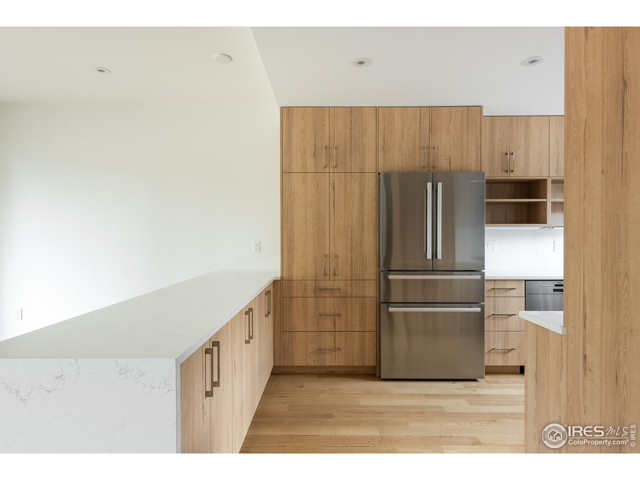 2130 Folsom Street Boulder, CO 80302 - Photo 9 of 40 a kitchen with cabinets and stainless steel appliances