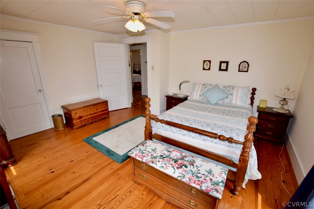 3675 Namozine Road Crewe, VA 23930 - Photo 23 of 48 a bedroom with a bed and a chandelier