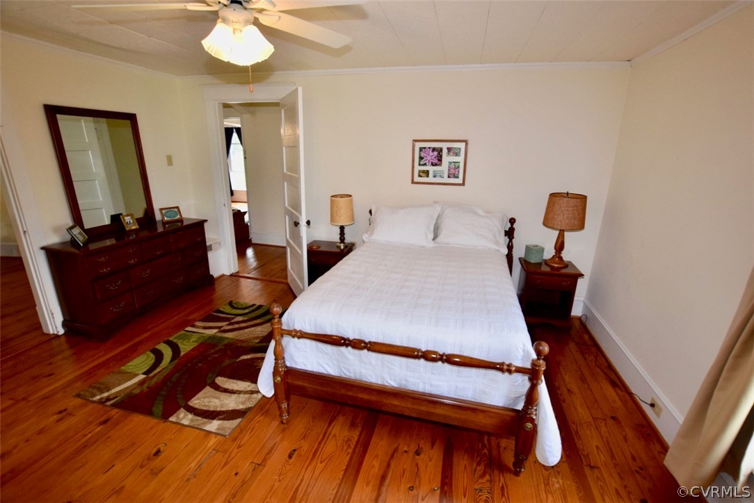 3675 Namozine Road Crewe, VA 23930 - Photo 28 of 48 a bedroom with a bed and dresser with mirror