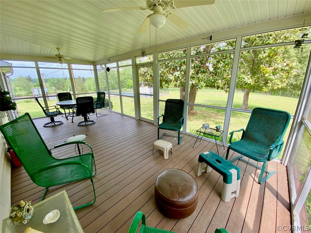 3675 Namozine Road Crewe, VA 23930 - Photo 36 of 48 a living room with furniture floor to ceiling window and wooden floor