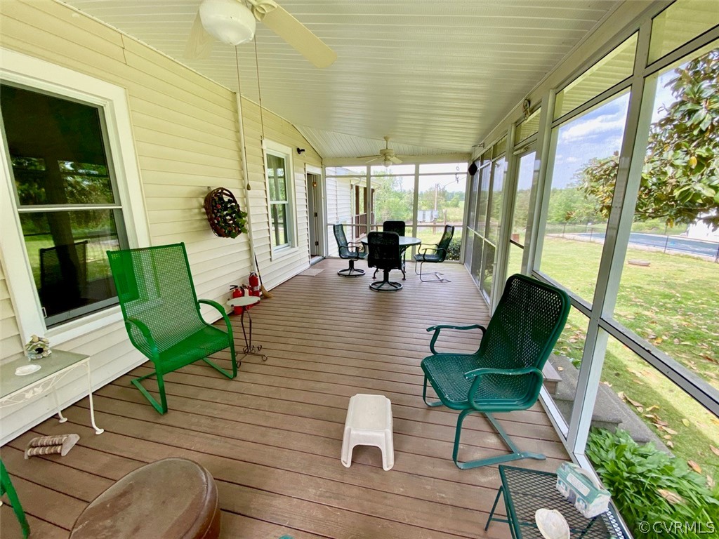 3675 Namozine Road Crewe, VA 23930 - Photo 37 of 48 a view of a patio with couches chairs potted plants and wooden floor