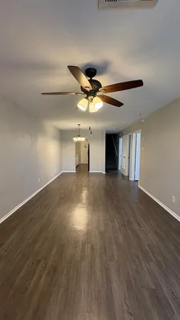 a kitchen with a refrigerator and a sink