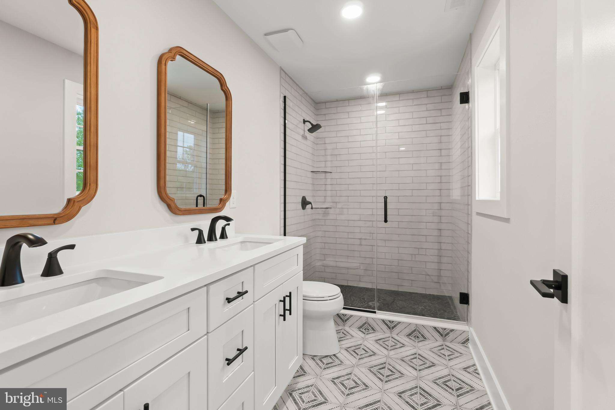1505 Chestnut Avenue Haddon Heights, NJ 08035 - Photo 26 of 38 a bathroom with a double vanity sink mirror and toilet