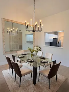 a dining room with furniture and wooden floor