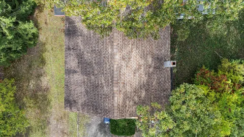 a aerial view of a house with a yard