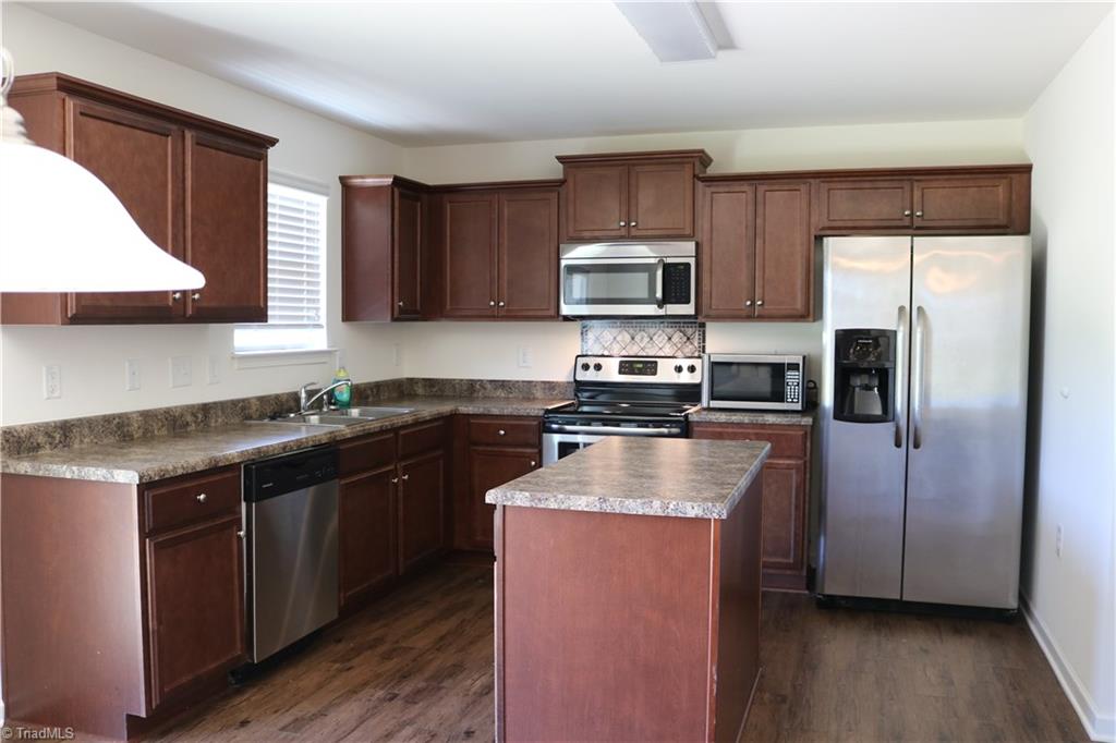 1912 Longshadow Street Rural Hall, NC 27045 - Photo 2 of 16 Nice kitchen with stainless steel appliances. They all stay.