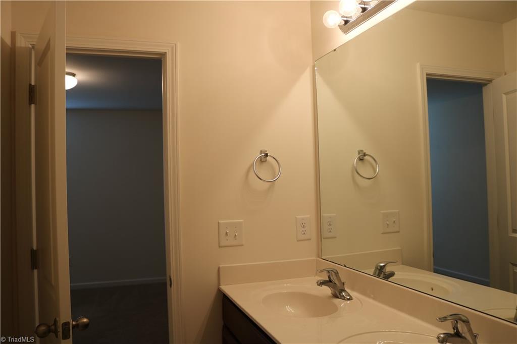 1912 Longshadow Street Rural Hall, NC 27045 - Photo 12 of 16 Hall bath with double sinks.