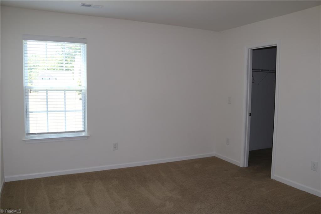 1912 Longshadow Street Rural Hall, NC 27045 - Photo 15 of 16 Bedroom 4 with a nice walk in closet