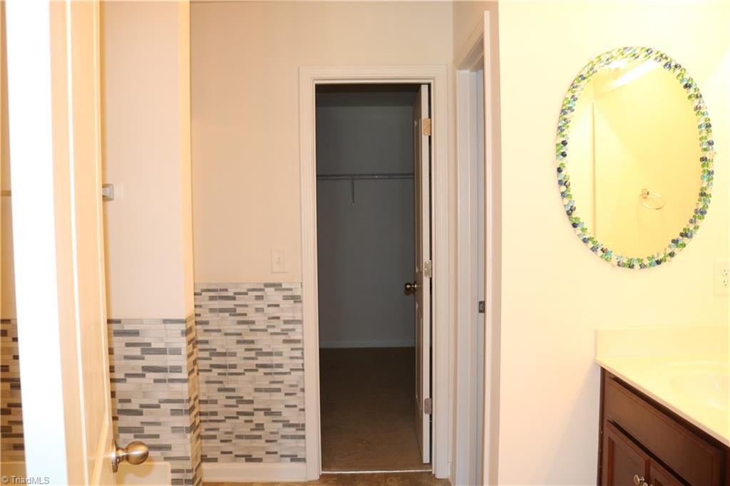 1912 Longshadow Street Rural Hall, NC 27045 - Photo 10 of 16 Master bathroom leads to a large walk-in closet.