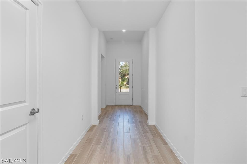 1395 Birdie Drive Naples, FL 34120 - Photo 5 of 17 a view of wooden floor in an empty room