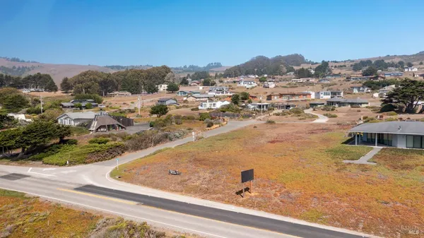a view of a swimming pool and mountains