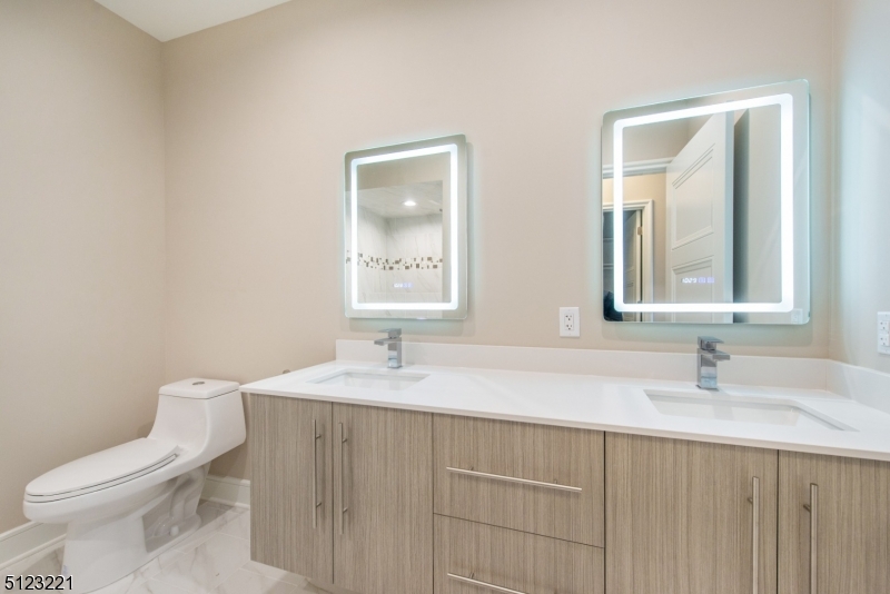 717 Preakness Avenue Wayne, NJ 07470 - Photo 17 of 19 a bathroom with a sink toilet and mirror