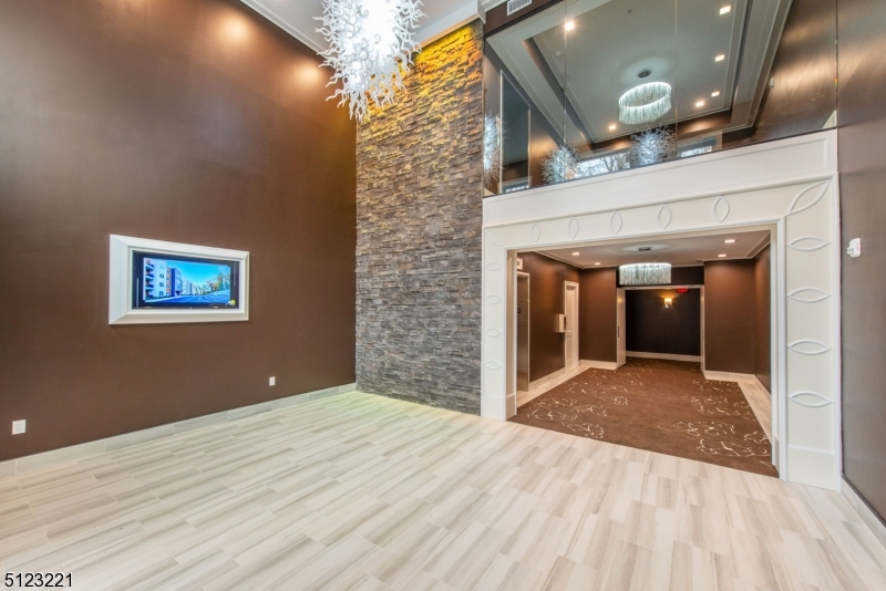 717 Preakness Avenue Wayne, NJ 07470 - Photo 2 of 19 a view of a hallway with wooden floor and a kitchen