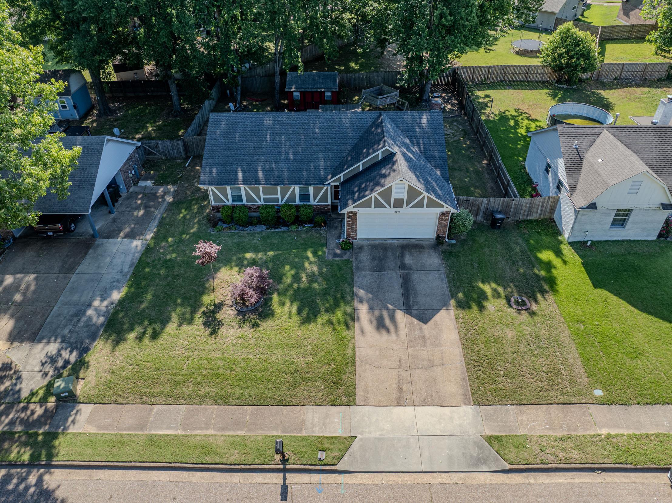 3276 Altruria Road Bartlett, TN 38134 - Photo 28 of 30 Traditional style residence featuring a two-car garage, concrete driveway, and established front lawn