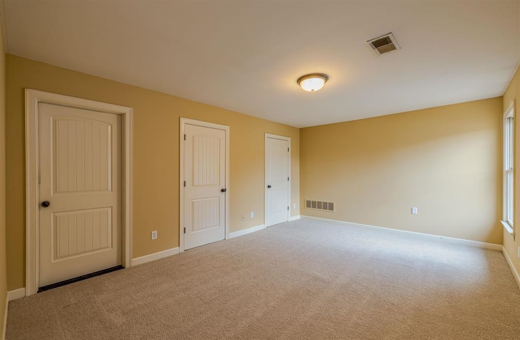 5380 Scarlet Ridge Drive Arlington, TN 38002 - Photo 21 of 35 Spacious room featuring light neutral wall paint and plush carpet flooring