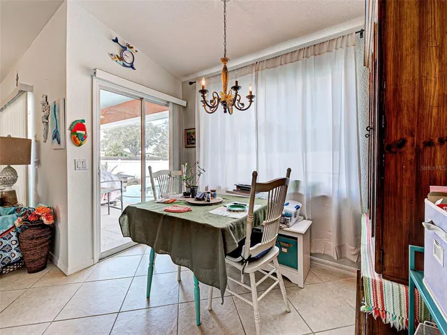 a swimming pool with outdoor seating and yard