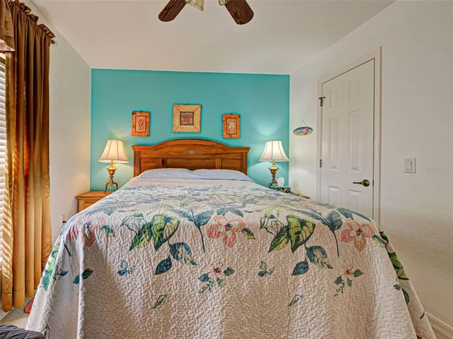 a bathroom with stainless steel appliances a sink and a rug