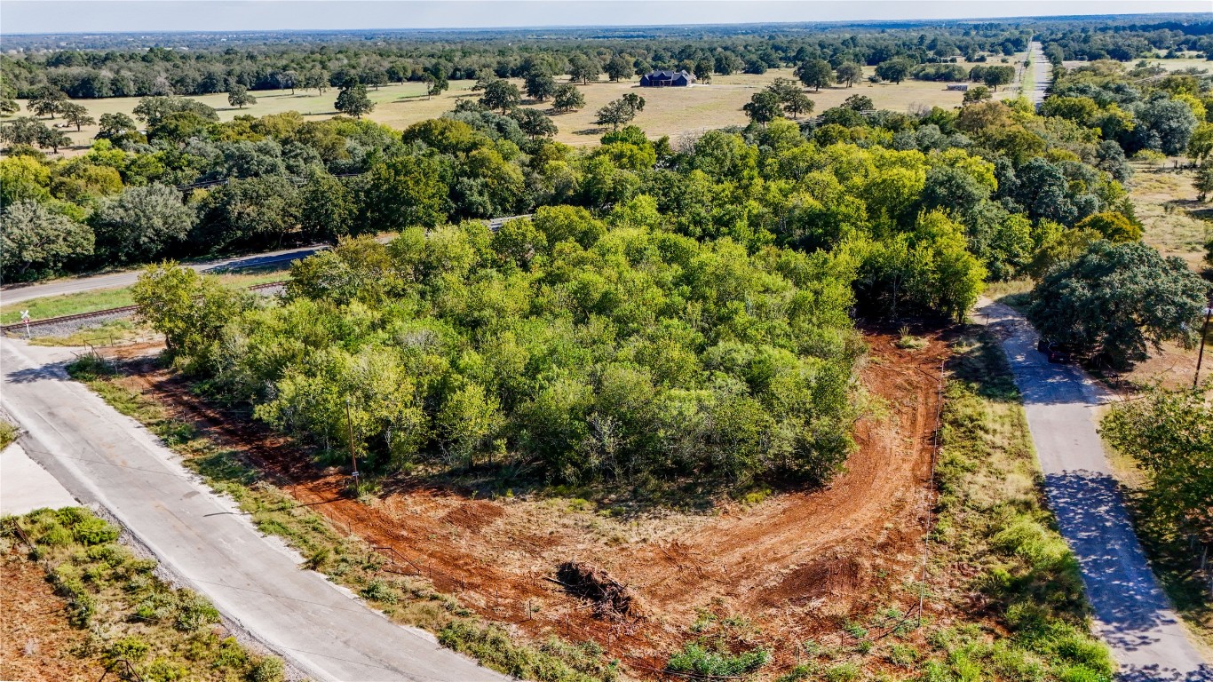 Tbd High Crossing Road Smithville, TX 78957 - Photo 6 of 9 a view of a lot of trees and houses