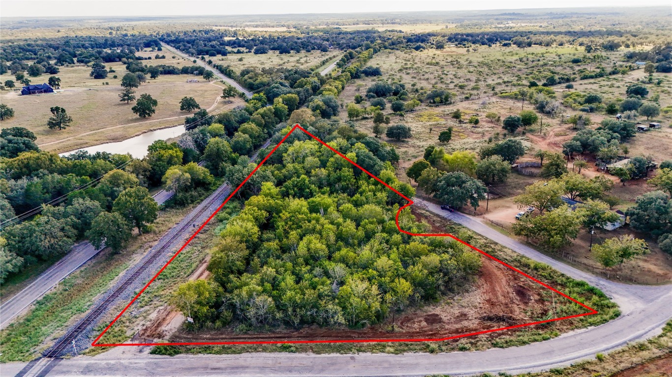 Tbd High Crossing Road Smithville, TX 78957 - Photo 8 of 9 an aerial view of residential houses with outdoor space and trees