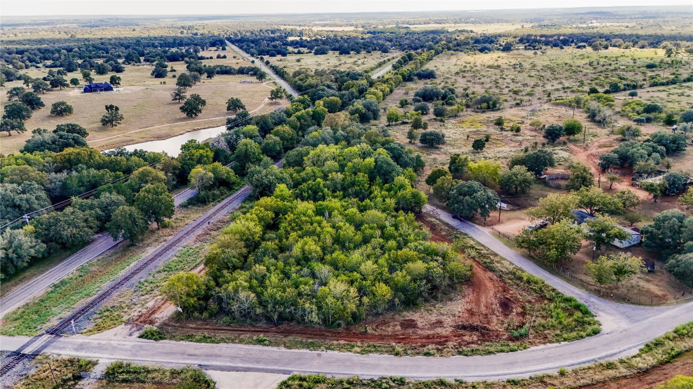 Tbd High Crossing Road Smithville, TX 78957 - Photo 9 of 9 an aerial view of a house with a yard and lake view