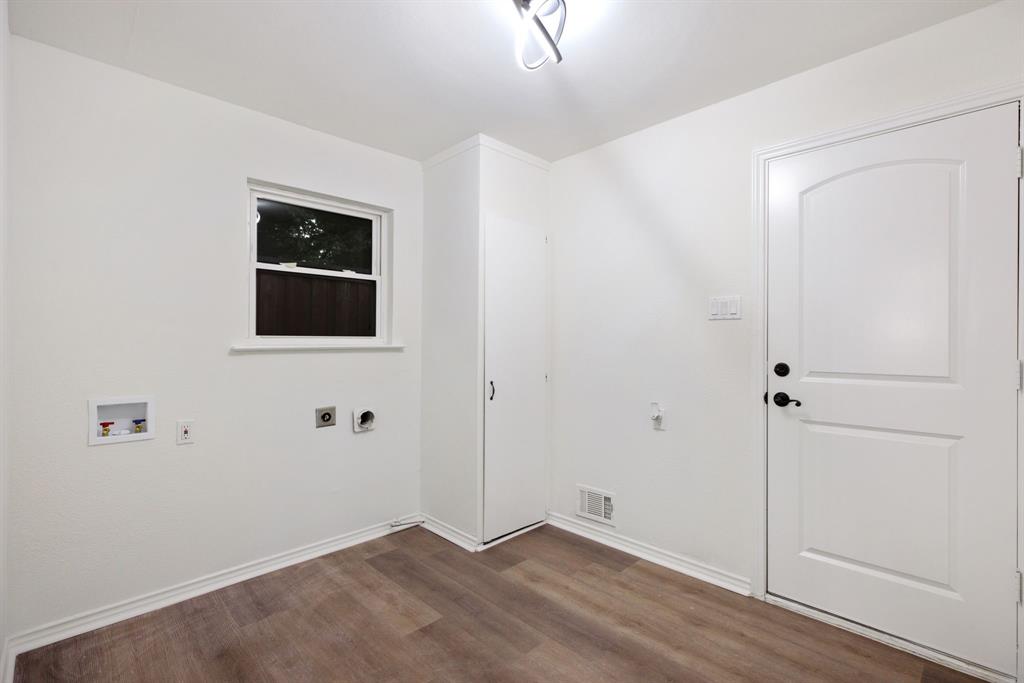 10922 Ferndale Road Dallas, TX 75238 - Photo 15 of 32 Washroom featuring electric dryer hookup, dark wood-style floors, and washer hookup